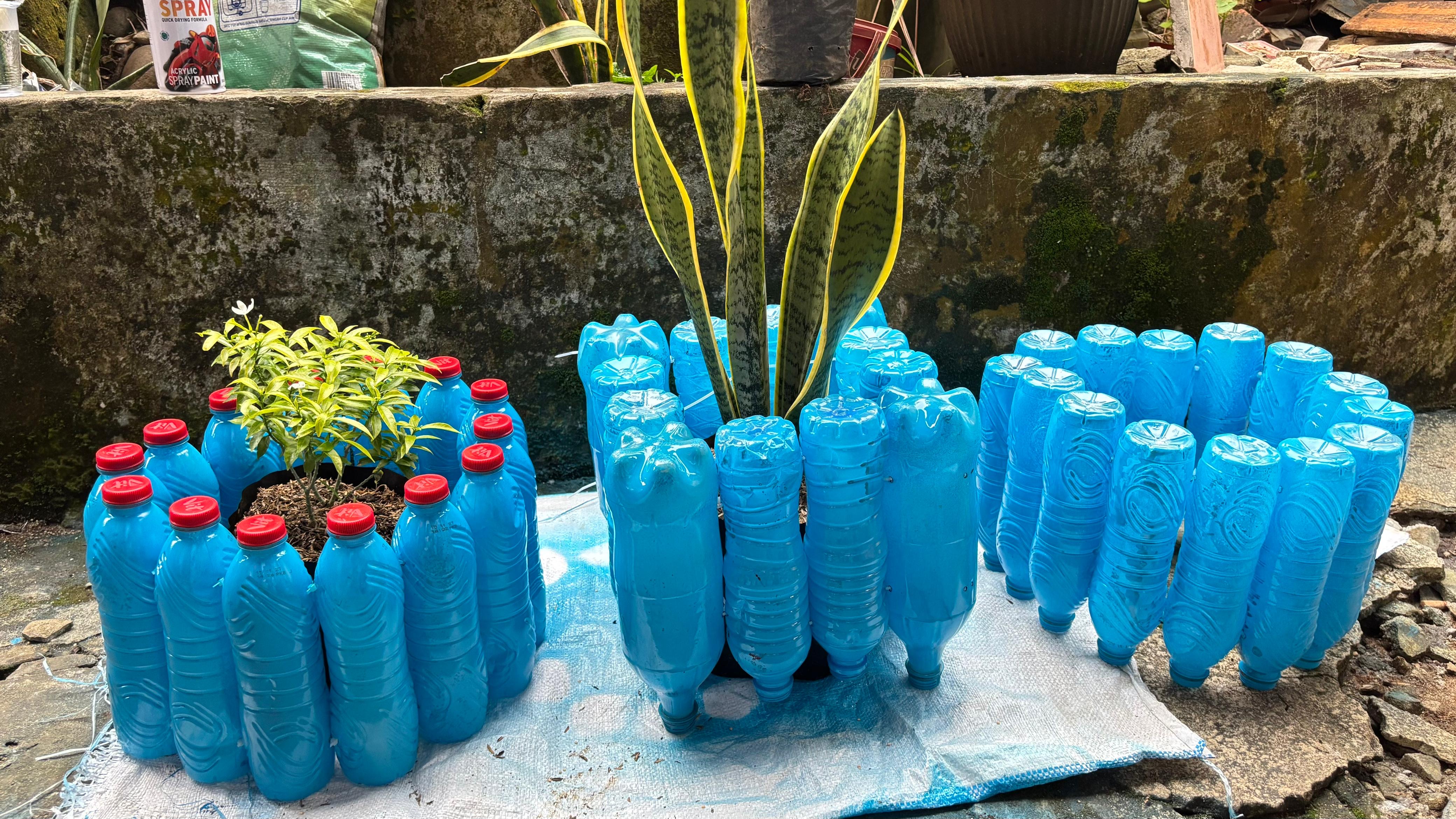 Hasil kerajinan tangan yaitu  Pot bunga dari botol bekas