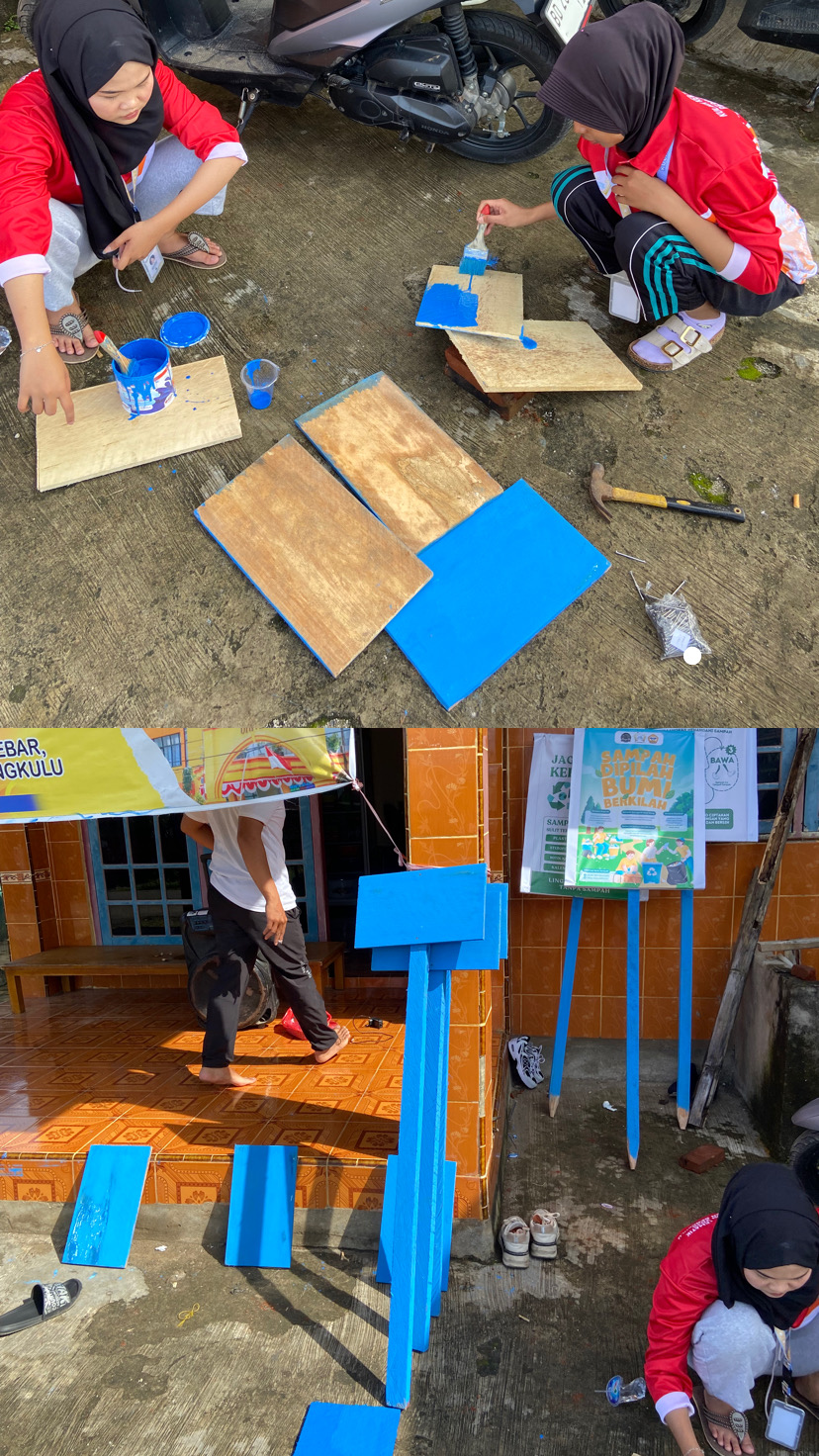 Melanjutkan pengecatan papan nama gang